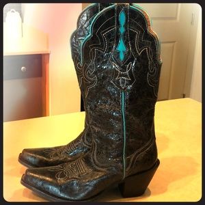 Women’s black cowboy boots with turquoise detail.
